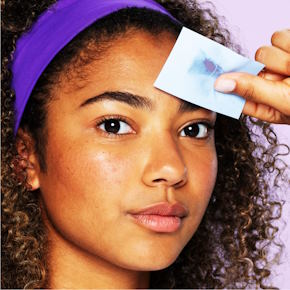 removing excess oil with blotting papers